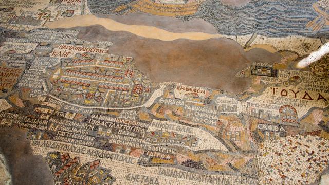 A mosiac map with brown areas of ruin