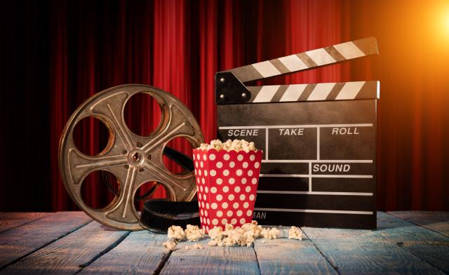 Retro film production accessories placed on wooden planks